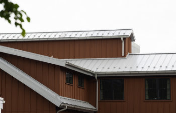 modern standig seam metal roof with roof window